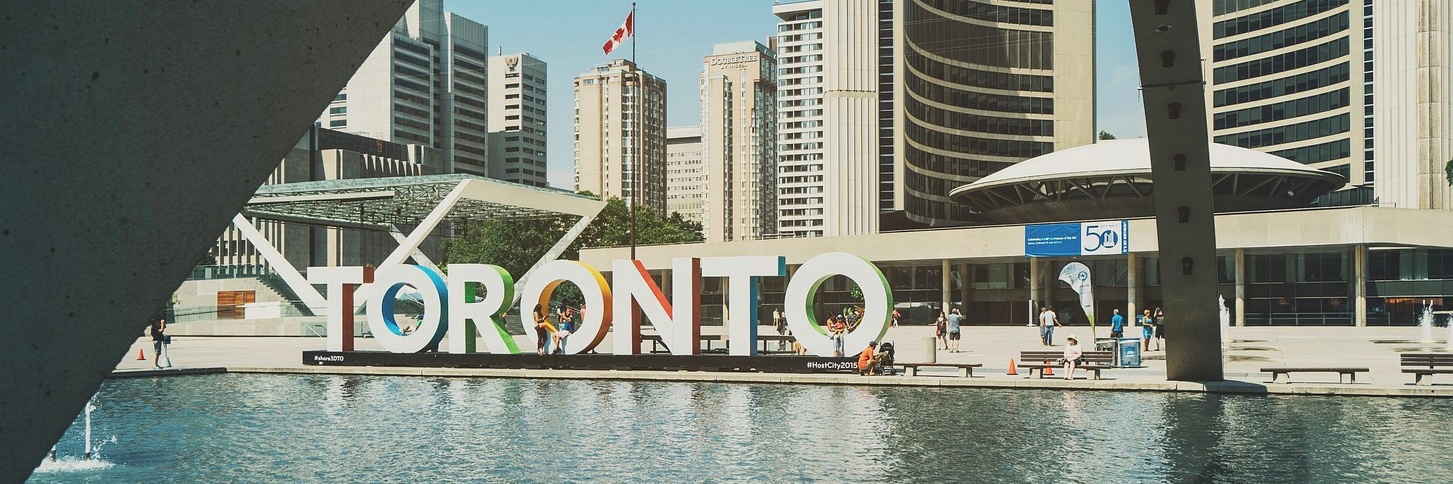 Toronto, Canada: colorful sign at Nathan Phillips Square with skyscrapers behind